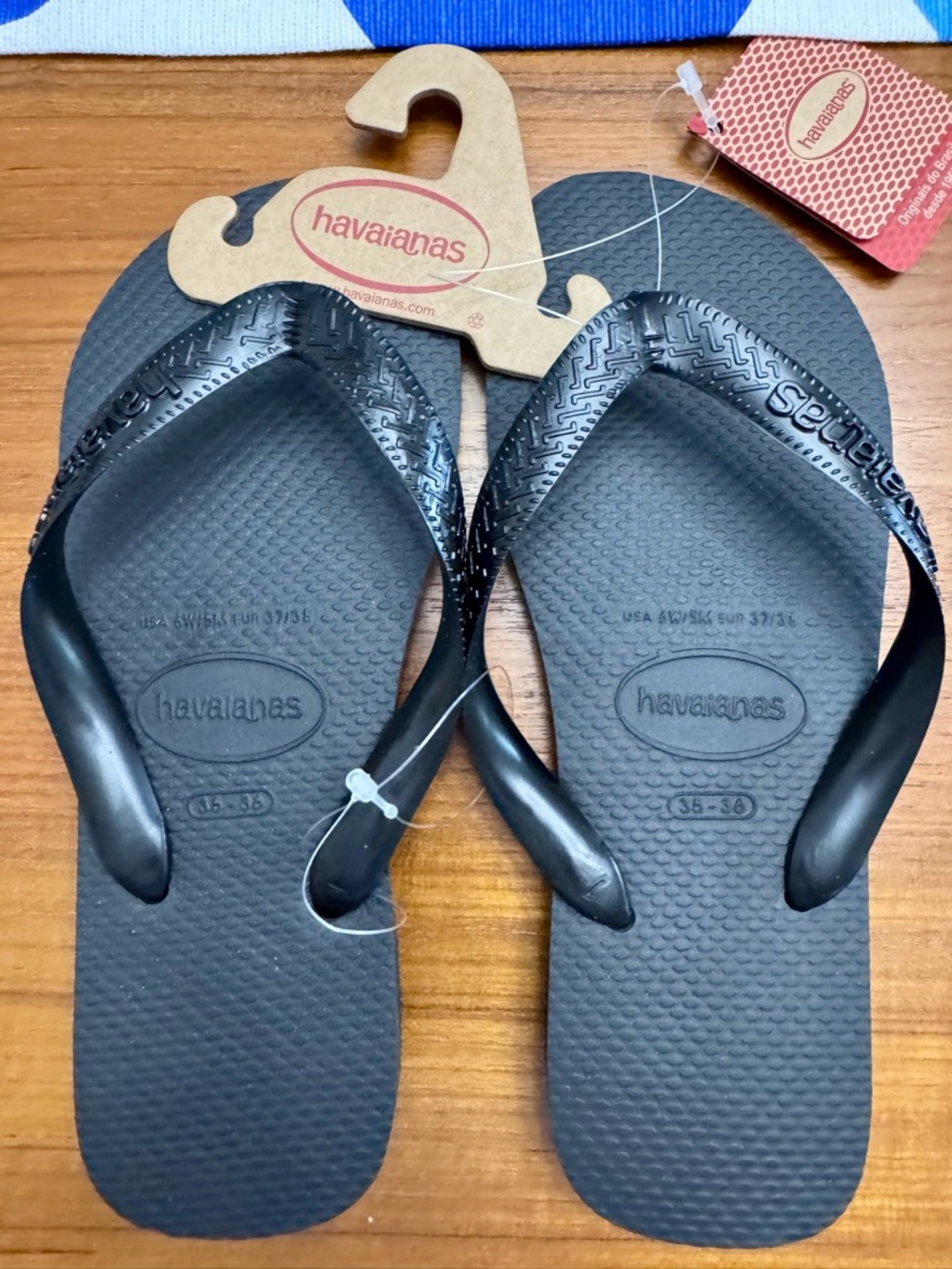 Havaianas Black Flip Flops with Red Accent